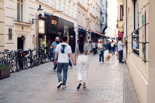 Adriana and Mario walking through Vienna First District Innere Stadt historic city center streets.