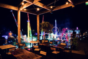 Outdoor terrace view overlooking Prater amusement park and ferris wheel from Neni am Prater.