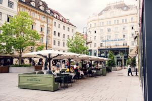 Summer terrace with guests at Plachutta's Neuer Markt in Vienna.