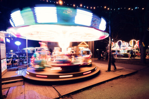 Entertainment area with festive lighting at Altes AKH Christmas Village.