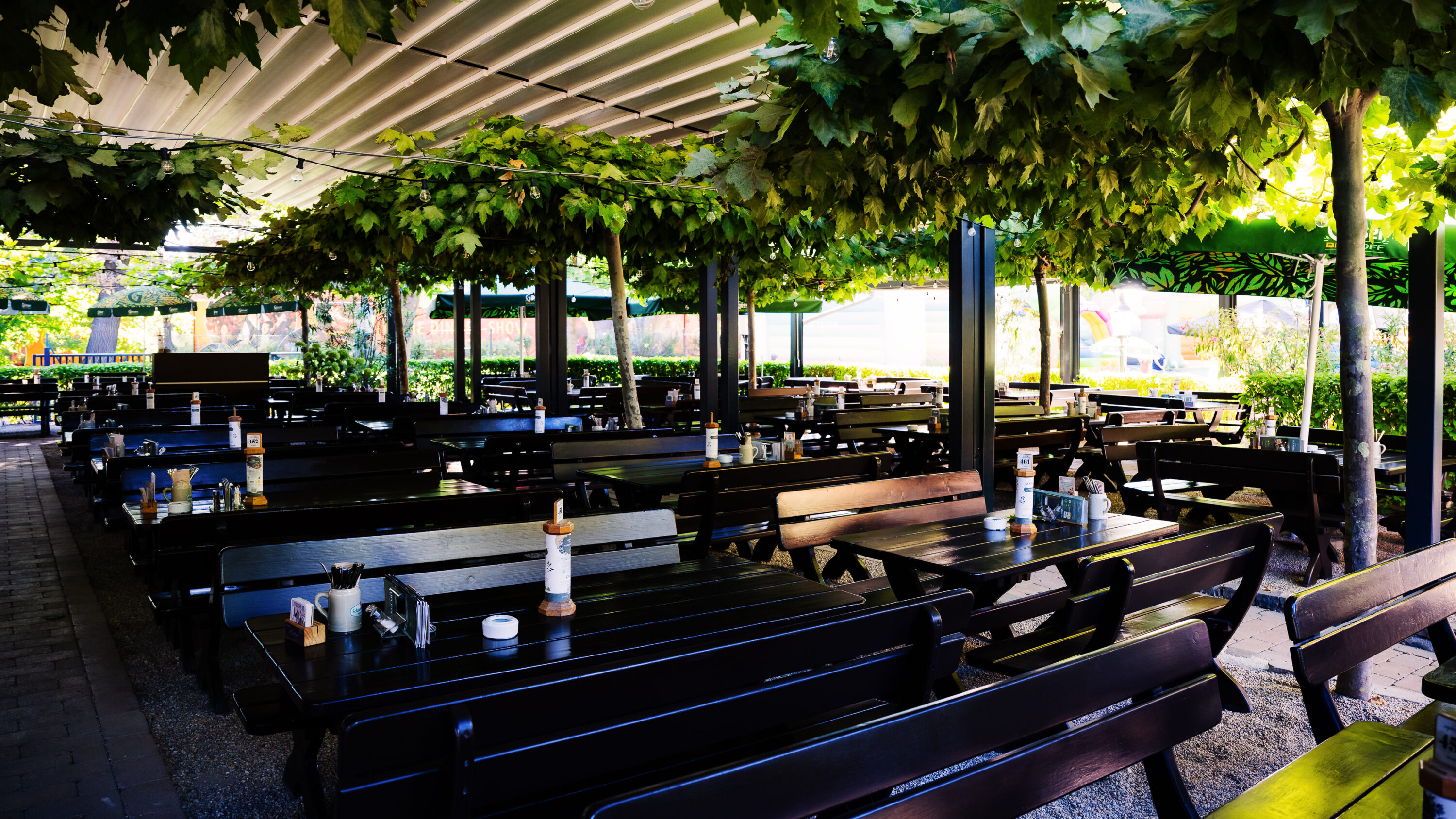 Spacious outdoor terrace at Luftburg Kolarik, perfect for enjoying a sunny day in Vienna's Prater.