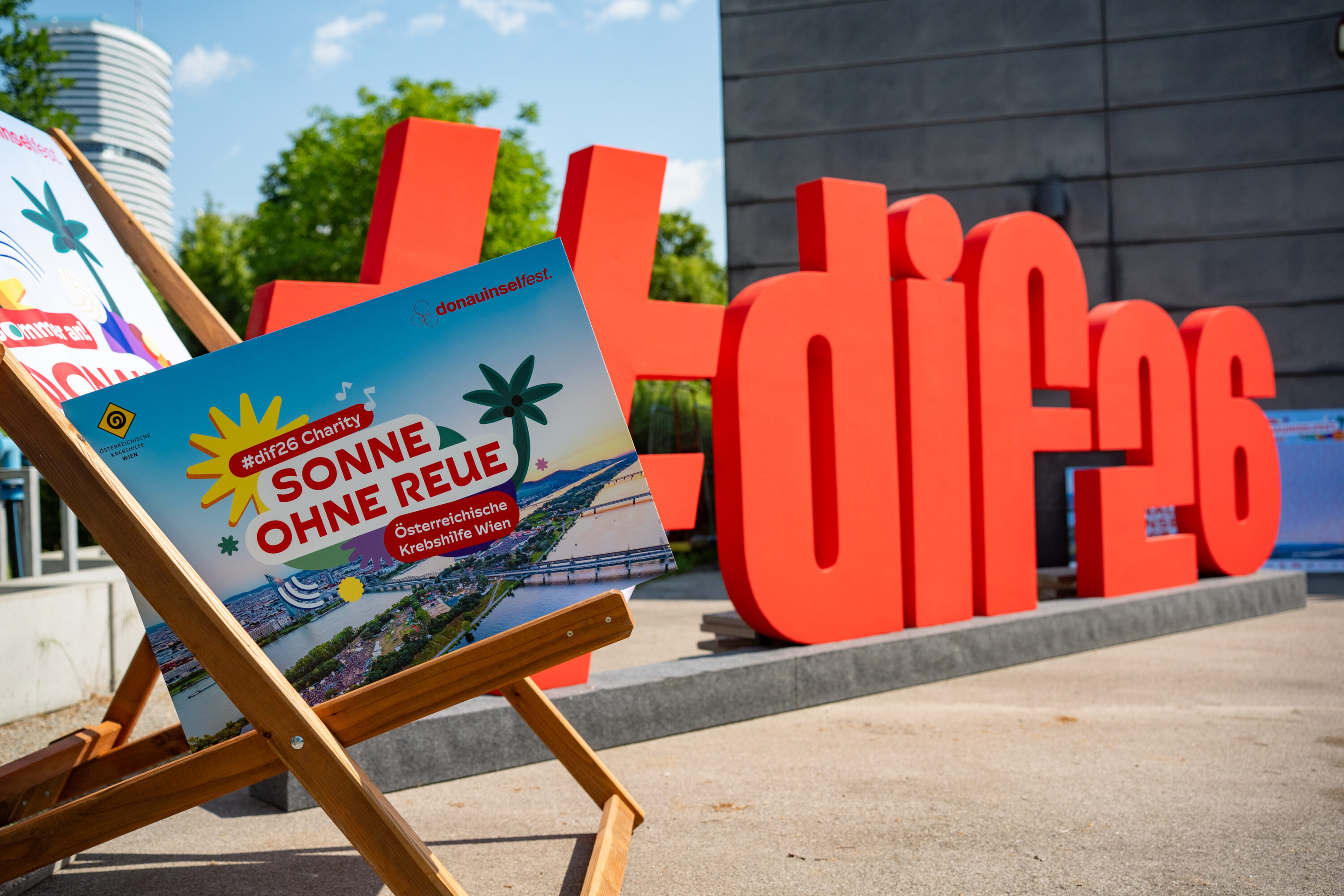 Large red hashtag dif26 letters and a deck chair at the Donauinselfest 2026 launch